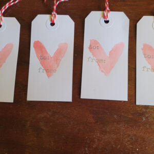 4 heart tags with painted hearts on them